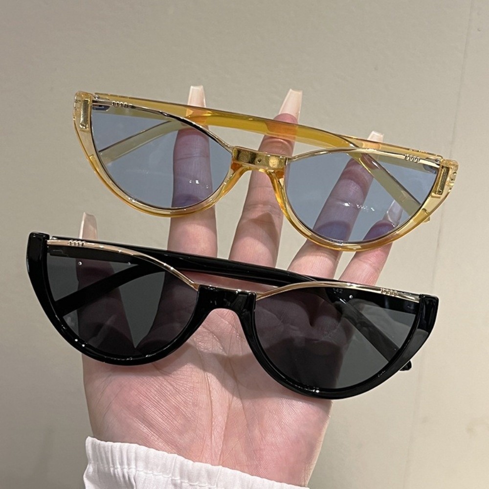 Street Fashion Photography - Mode Cat Eye-zonnebril met half montuur